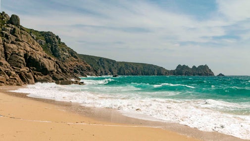 The beach and crashing waves at Porthcurno, Cornwall